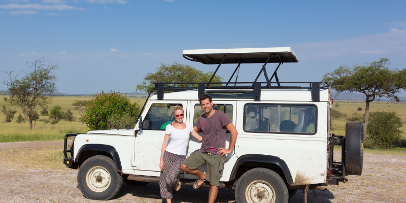 Happy travelers on Tanzania safari adventure